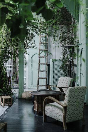 Ladder near green Arabic building