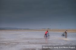 Two boys with bikes in salt marshes, France 4MpZG5