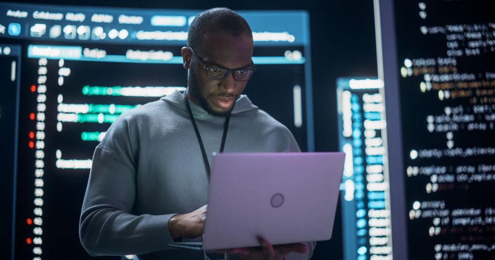 Portrait of Professional Programmer Developing a Big Data Interface Software Project.