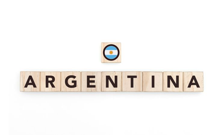 Wooden blocks bearing the name and flag of Argentina. Latin and South American Culture, national identity, travel, and geography in a copy space design.