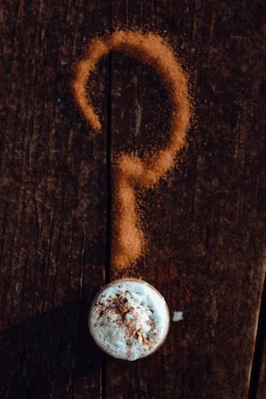 Cupcake near question mark and coffee
