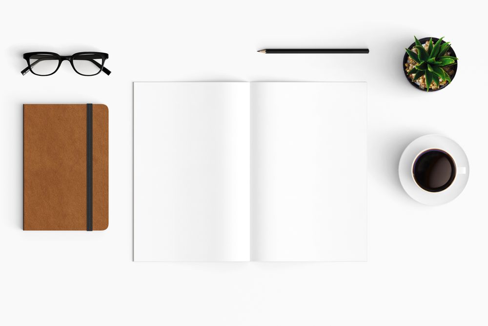 Modern workspace with coffee cup, smartphone, paper, tablet and notebook copy space