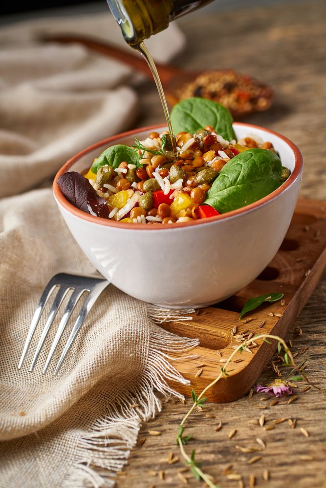 Bright vegetables with lentils and spinach in bowl