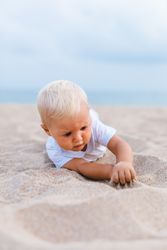 Blond baby on the beach