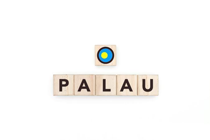 Wooden blocks bearing the name and flag of Palau.