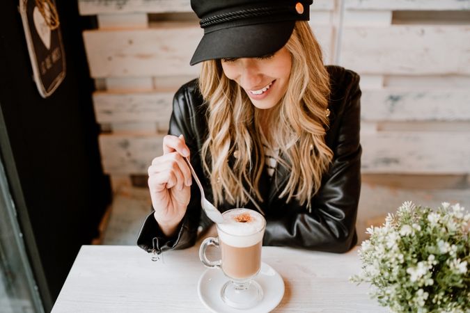 Woman drinking coffee from a glass