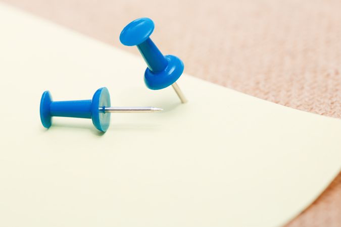Adhesive note and pushpins