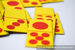 Close up of red and yellow domino playing cards on table 5Xrw2r
