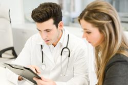 Doctor with patient in clinic