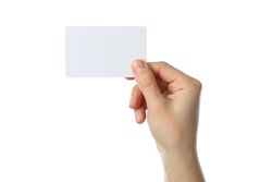 Female hand holding blank business card, isolated on plain background