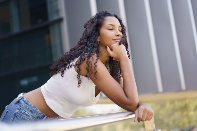 A Contemplative Young Woman Enjoying a Peaceful and Reflective Moment Outdoors in Nature