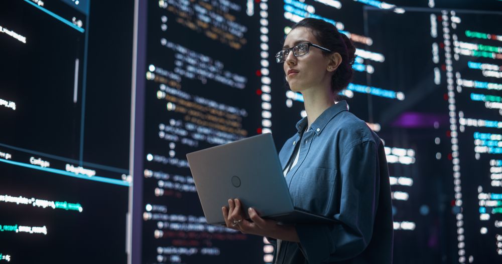 Female Programmer Working in a Monitoring Room in Futuristic Concept