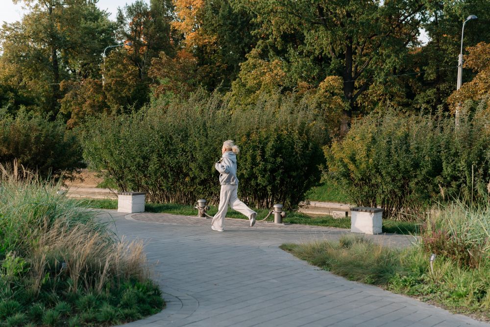 Woman jogging in grey outfit