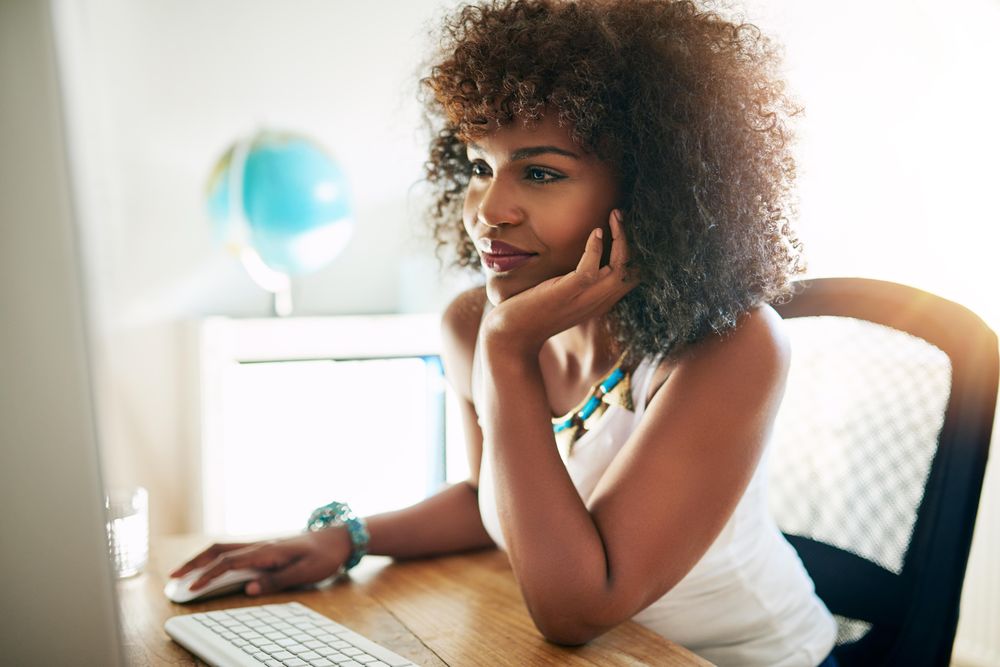 Female entrepreneur working intensely on her computer