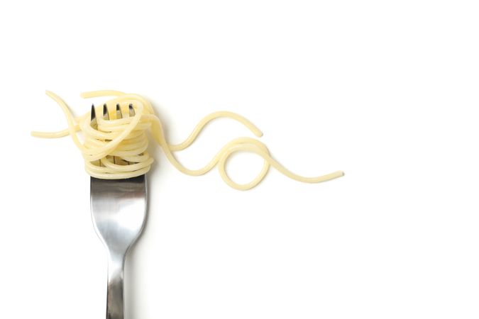 Fork with tasty pasta isolated on blank background