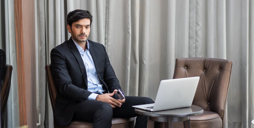 Businessman in suit with laptop