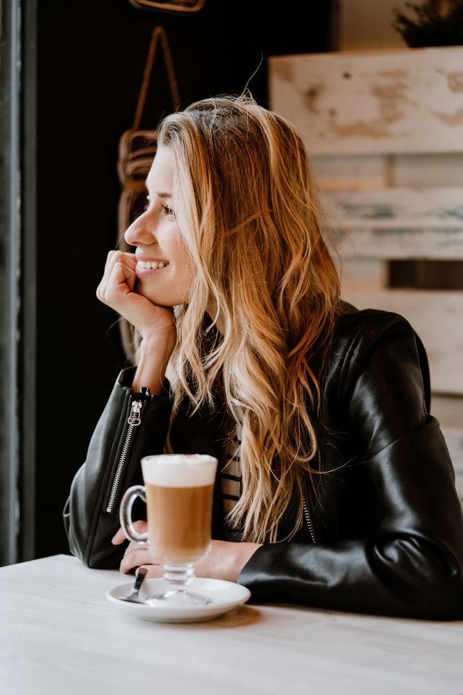 Woman drinking coffee from a glass