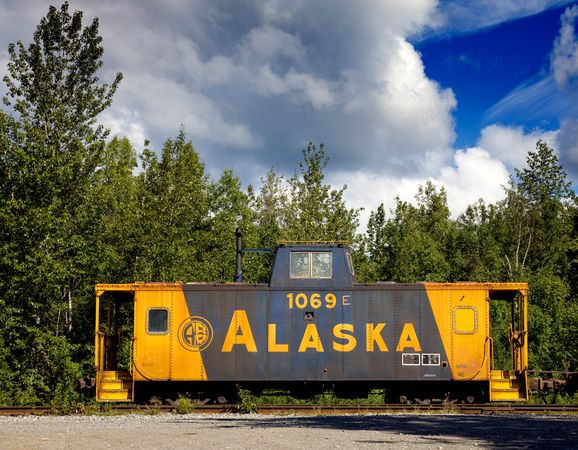 Old abandoned railroad box car sits on tracks Alaska