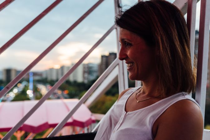 Mother riding Ferris wheel