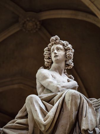 Ancient sculpture in one of the churches of Paris. Antique art.