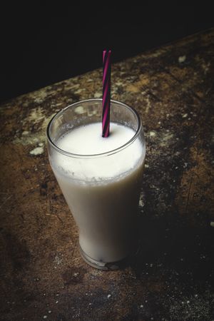 Glass of milk on table