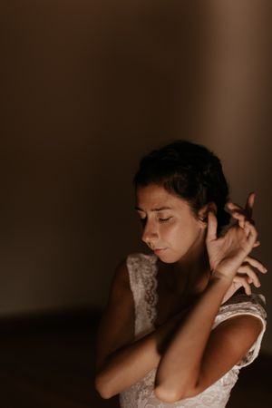 woman sitting in dark room