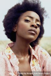 Portrait of Black woman in floral top 5lKav0