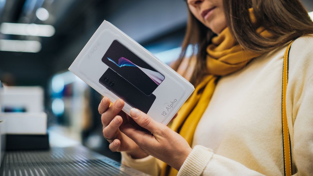 Client Shopping for a New Mobile Phone in a Home Electronics Store