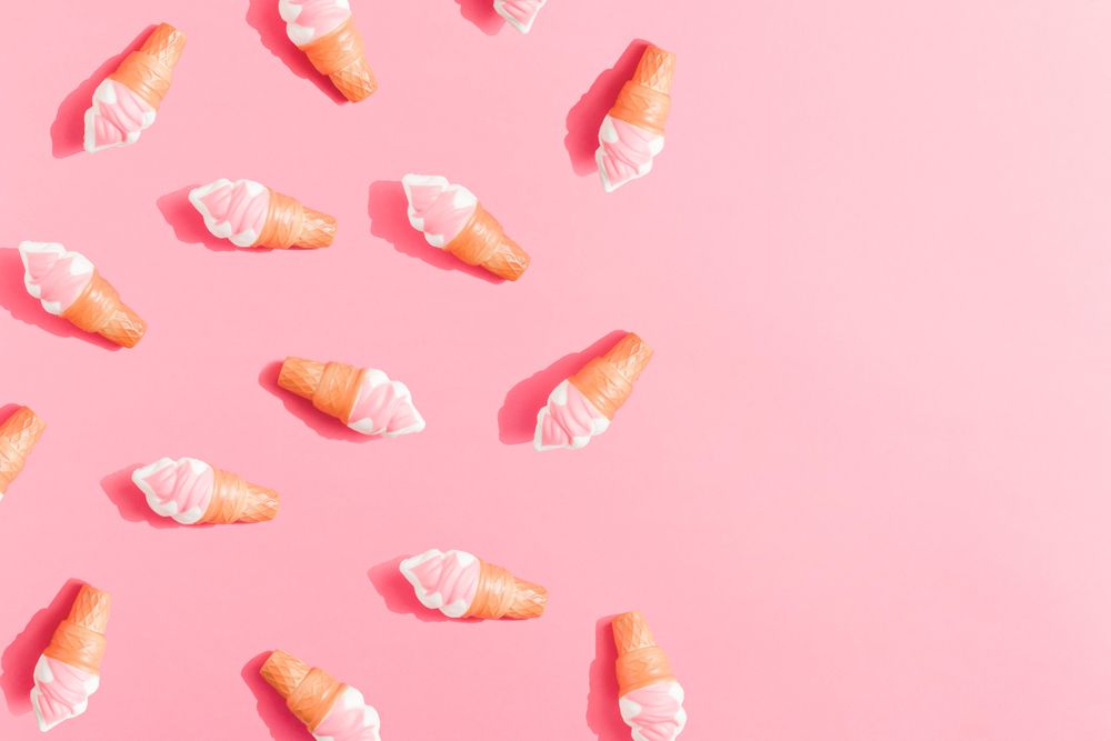 Ice cream in cones on pink background