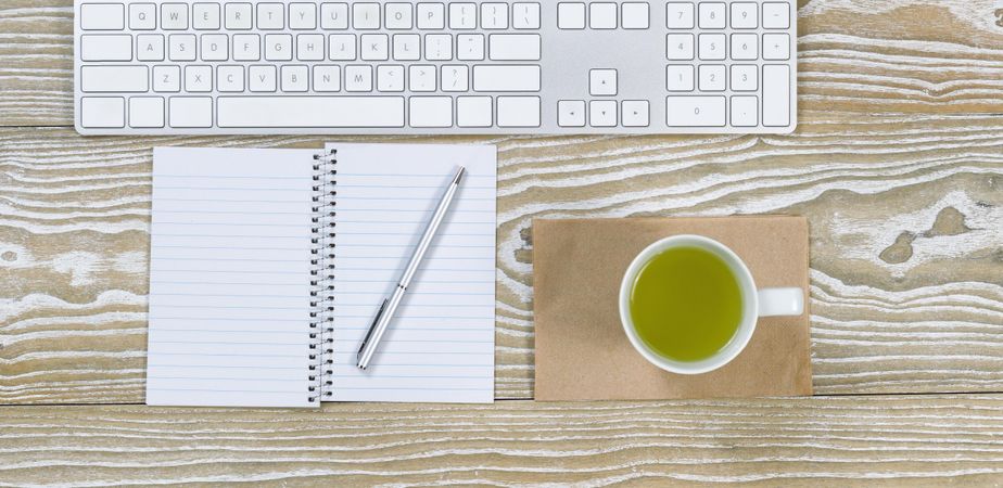 Basic office desktop with green tea drink