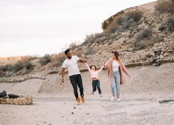 Stylish multiethnic family walking on nature