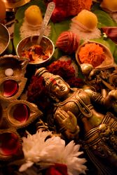 Buddha golden statue surrounded by Diwali ornaments