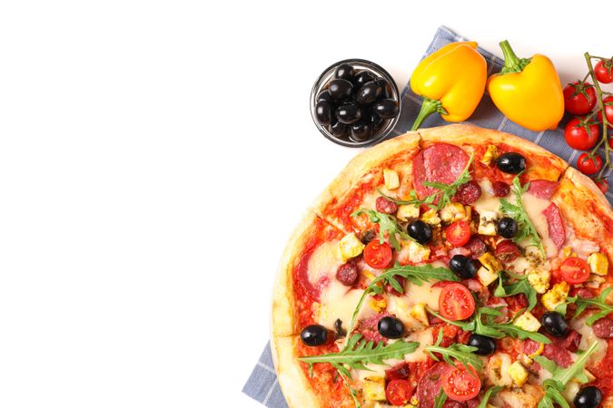 Tasty pizza, ingredients and towel isolated on blank background