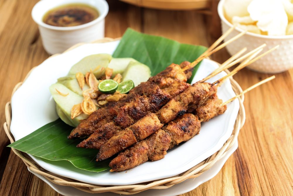 Close Up Sate Ayam madura Served with Pressed Rice Cake or Lontong