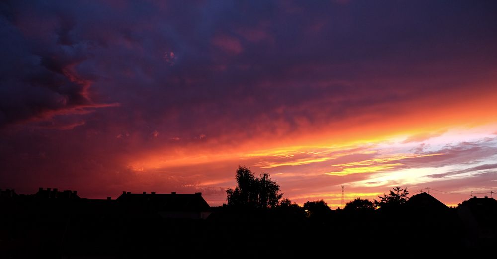 Vibrant sunset over rooftops in France
