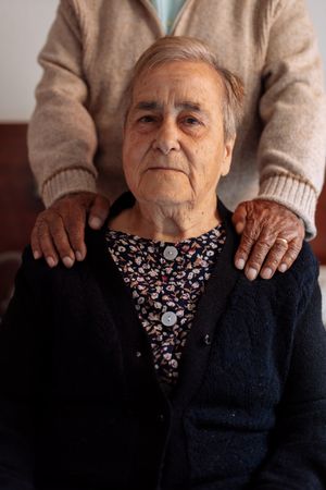 older couple in interior of their house
