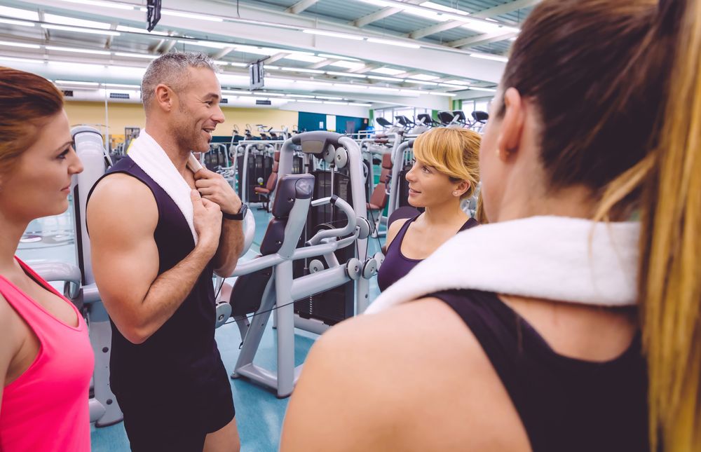 Group of fit people chatting after exercise