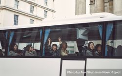 London, England, United Kingdom - March 23rd, 2019: Group of people looking out the window of a bus 5zrmP5