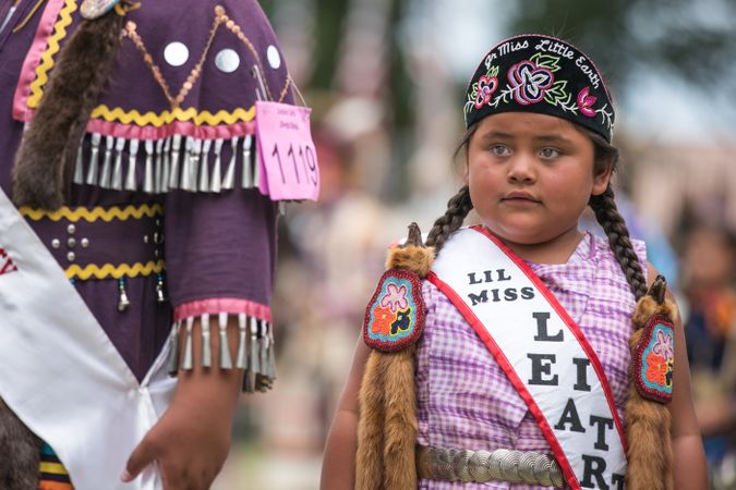 Red Wing, MN, USA - July 8th, 2017: Sioux girl weather Little Miss Earth sash at Pow Wow