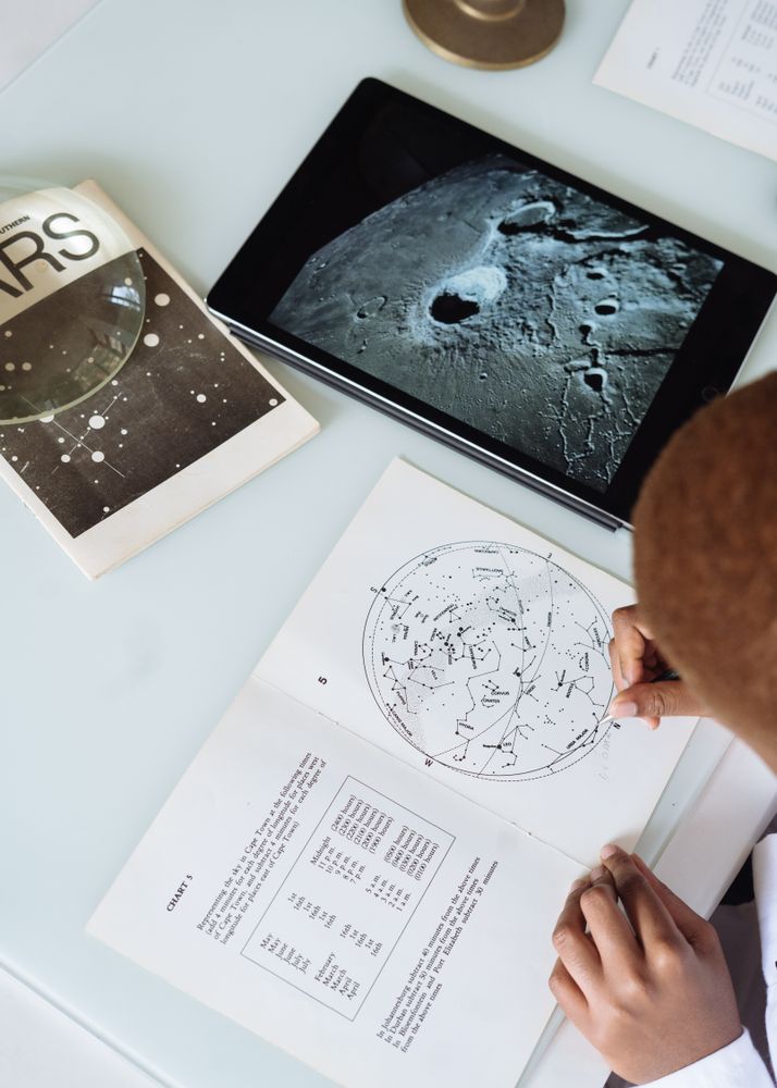 Top view of person studying astronomy