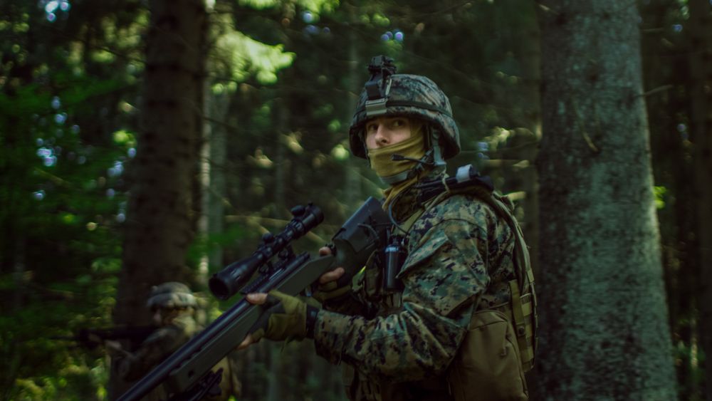 Fully Equipped Sniper Soldier Wearing Camouflage Uniform Attacking Enemy.