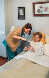 Female doctor showing results of a medical test on the tablet