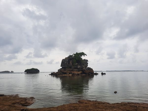 A Coastal Reef In The Middle Of A Cloudy Sea