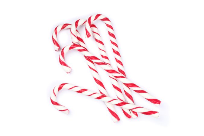 Sweet candy canes isolated on blank background