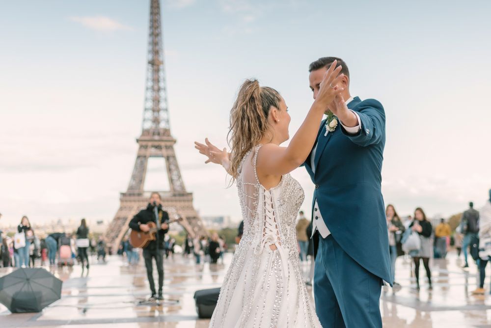 Happy newlyweds in wedding clothing dancing together