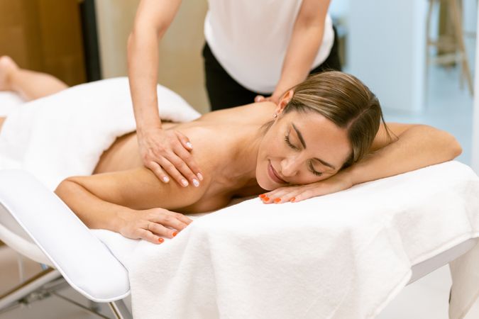 Woman receiving a relaxing massage at the spa