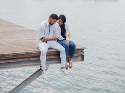 Woman with man using phone