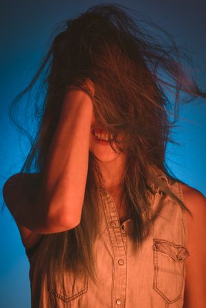 woman touching her hair