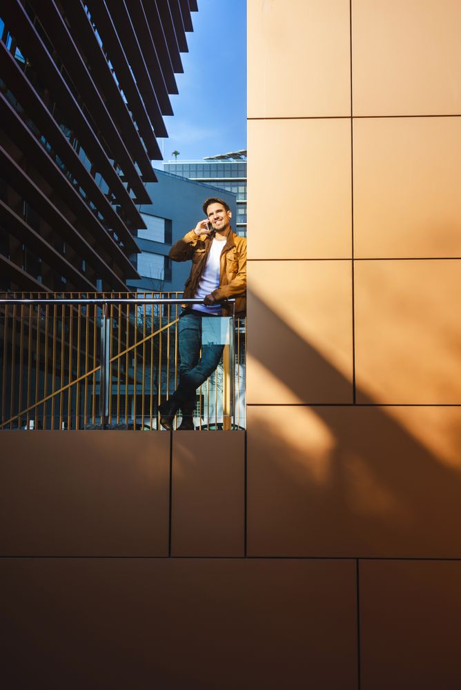 Man using mobile phone in modern building