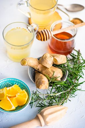 Ginger detox drinks with citrus, rosemary and honey